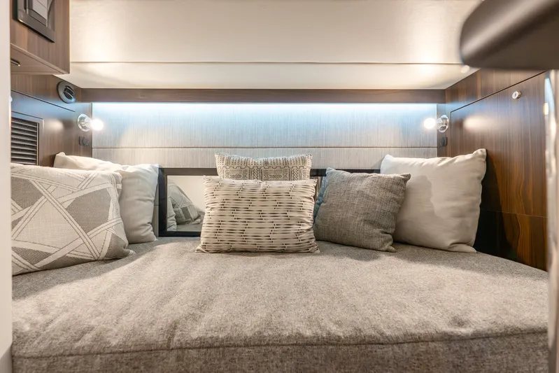 South Beach Edition -- Like New Trade In Yacht Photos Pics Luxurious cabin interior of 2024 Cruisers Yachts 34 GLS OB with plush pillows.