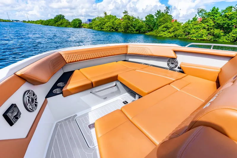 South Beach Edition -- Like New Trade In Yacht Photos Pics Luxurious seating on 2024 Cruisers Yachts 34 GLS OB, featuring tan upholstery and scenic water view.