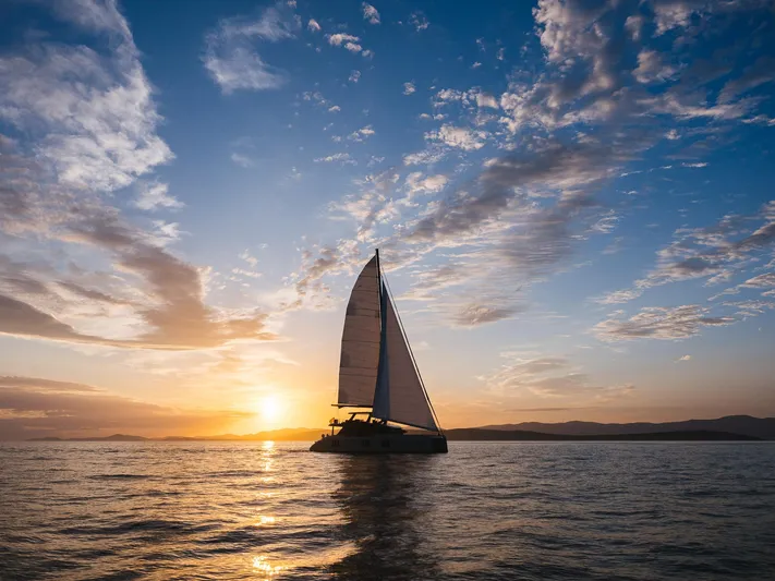 N+1 Yacht Photos Pics Sailing yacht Sunreef 70 Eco 2024 at sunset on open sea.