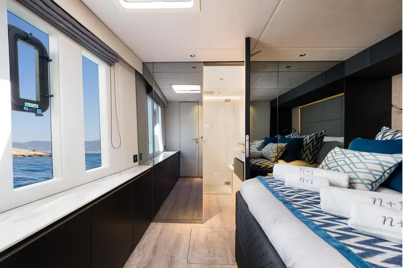 N+1 Yacht Photos Pics Luxurious interior of 2024 Sunreef 70 Eco yacht with ocean view and elegant decor.