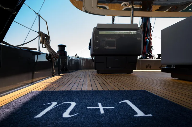 N+1 Yacht Photos Pics 2024 Sunreef 70 Eco yacht deck with "n+1" mat, showcasing luxury and sustainability.
