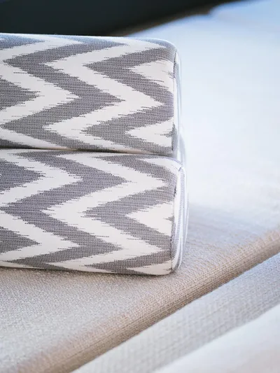 N+1 Yacht Photos Pics Gray and white zigzag patterned cushions on Sunreef 70 Eco yacht, 2024 model.