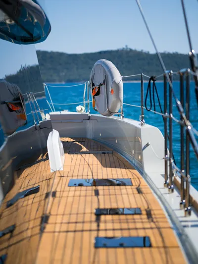 N+1 Yacht Photos Pics 2024 Sunreef 70 Eco yacht deck with ocean view and life preserver.