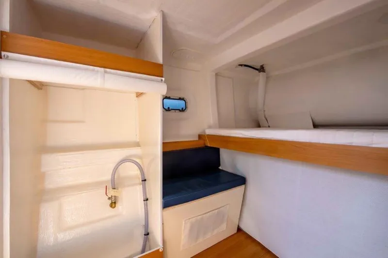  Yacht Photos Pics Custom DAYCHARTER 2026 interior with bunk bed, seating, and storage.