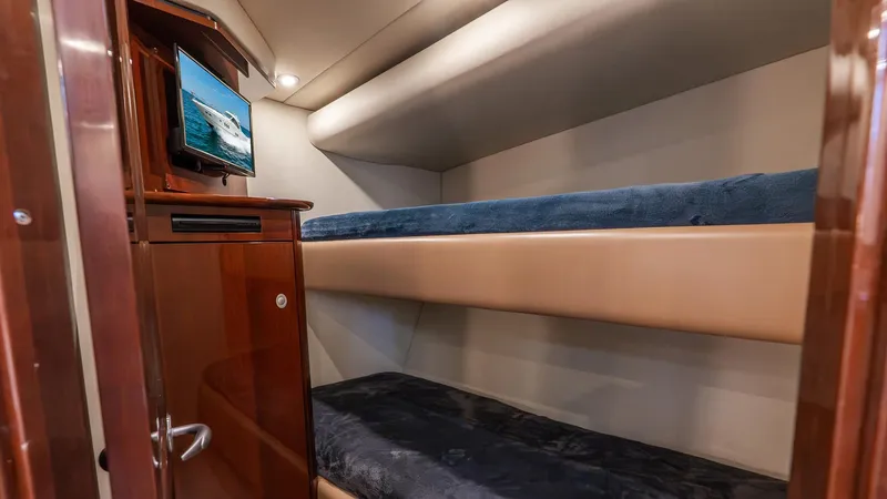 Three Sons Yacht Photos Pics 2008 Sea Ray Sundancer cabin with bunk beds and a small TV.