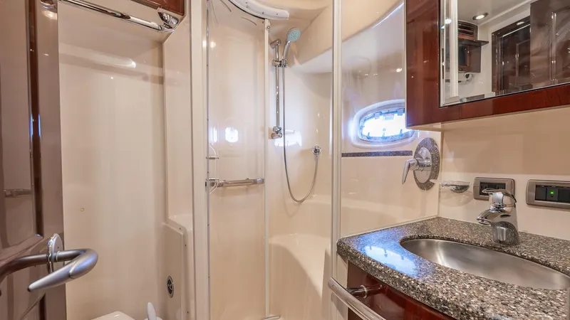 Three Sons Yacht Photos Pics Luxurious bathroom in 2008 Sea Ray Sundancer yacht with granite countertop and shower.