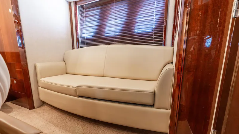 Three Sons Yacht Photos Pics Luxurious interior of 2008 Sea Ray Sundancer yacht with beige leather sofa.