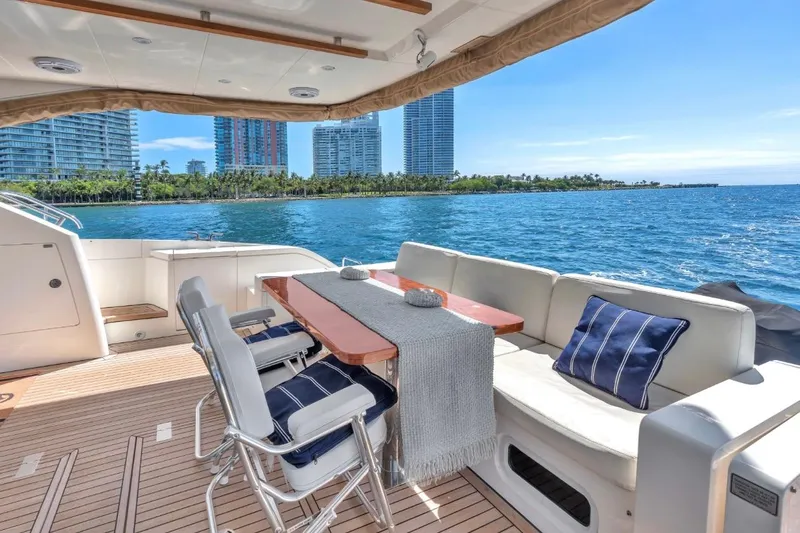  Yacht Photos Pics Luxury yacht Fairline Squadron 66, 2013 model, with elegant deck seating and ocean view.