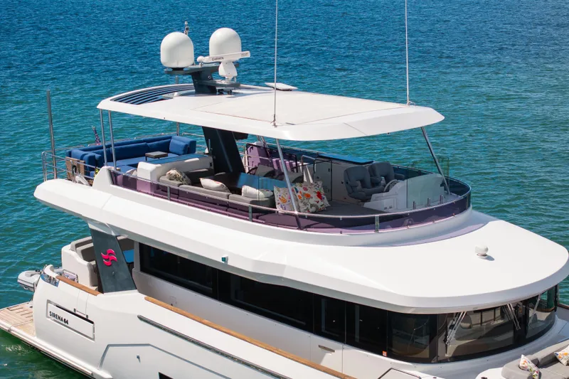 Amor Fati Yacht Photos Pics Luxurious 2019 Sirena 64 yacht with spacious deck and modern design on blue water.