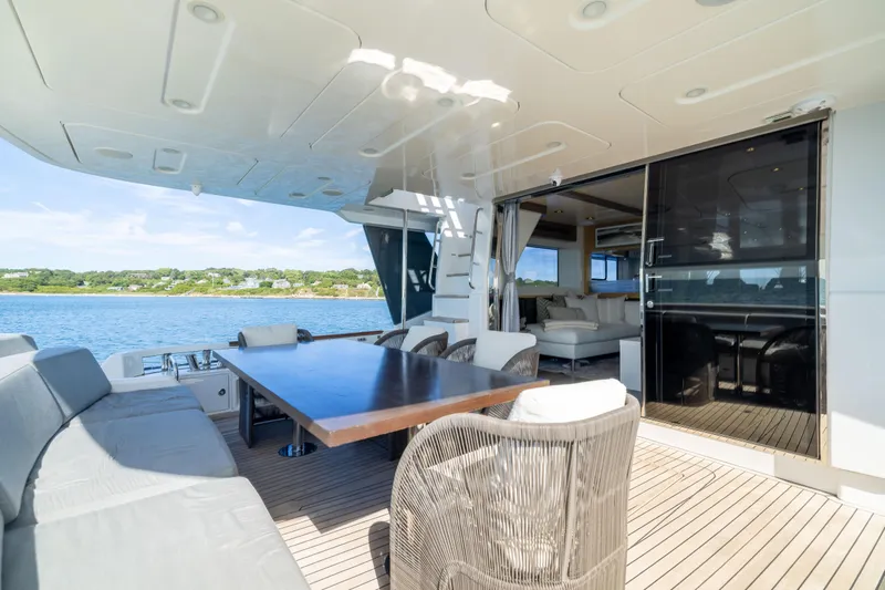 Amor Fati Yacht Photos Pics Luxurious 2019 Sirena 64 yacht deck with elegant seating and ocean view.