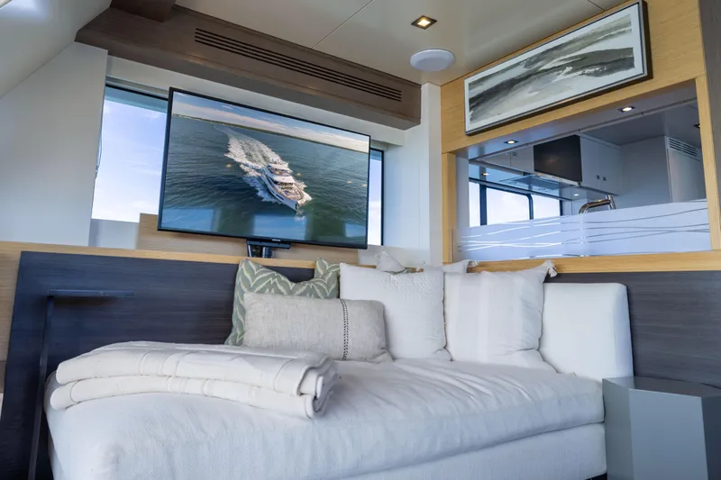 Amor Fati Yacht Photos Pics Luxurious interior of 2019 Sirena 64 yacht with cozy seating and modern decor.