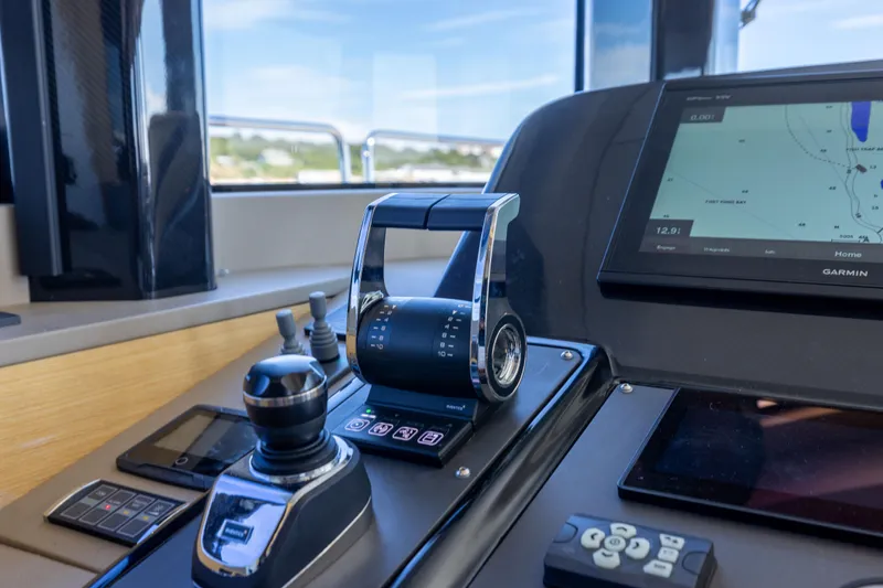 Amor Fati Yacht Photos Pics Cockpit controls of a 2019 Sirena 64 yacht with navigation display.