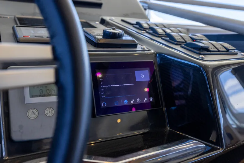 Amor Fati Yacht Photos Pics Control panel of 2019 Sirena 64 yacht with touchscreen and navigation controls.