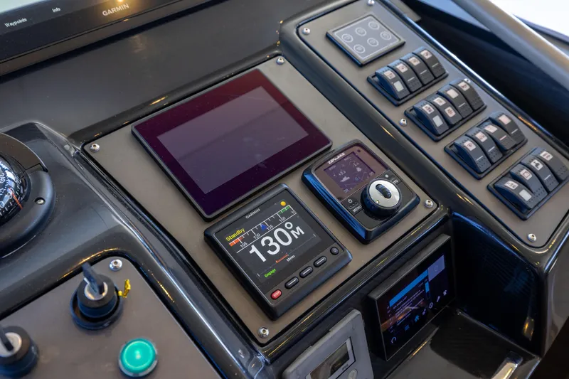 Amor Fati Yacht Photos Pics Control panel of 2019 Sirena 64 yacht with navigation and system displays.
