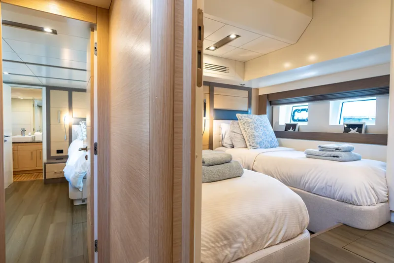 Amor Fati Yacht Photos Pics Luxurious 2019 Sirena 64 yacht interior with twin beds and modern bathroom.