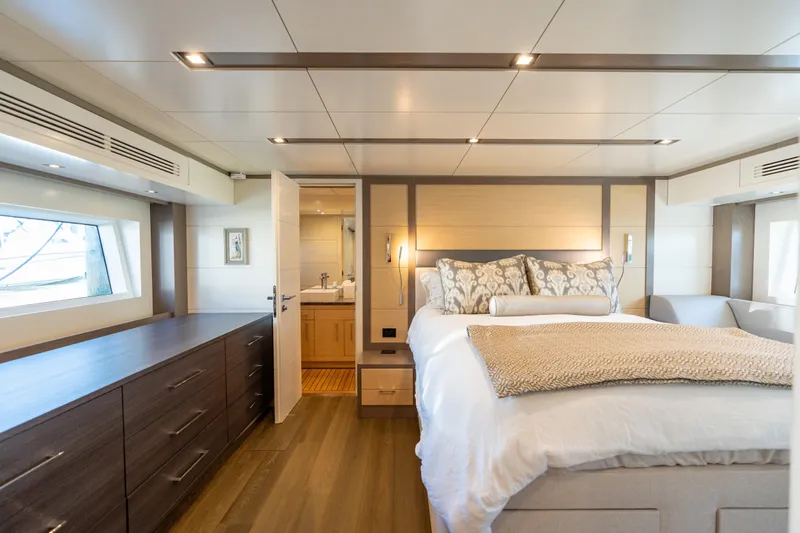 Amor Fati Yacht Photos Pics Luxurious 2019 Sirena 64 yacht bedroom with elegant decor and modern furnishings.