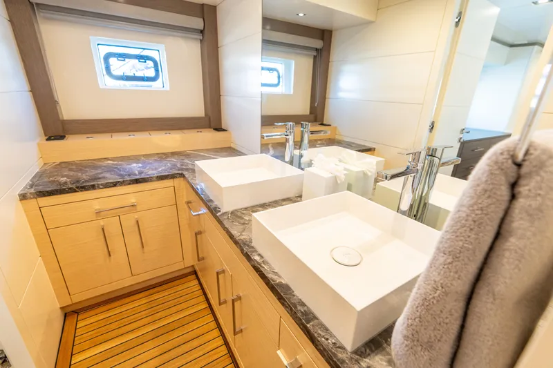 Amor Fati Yacht Photos Pics Luxurious bathroom in 2019 Sirena 64 yacht with modern fixtures and elegant design.