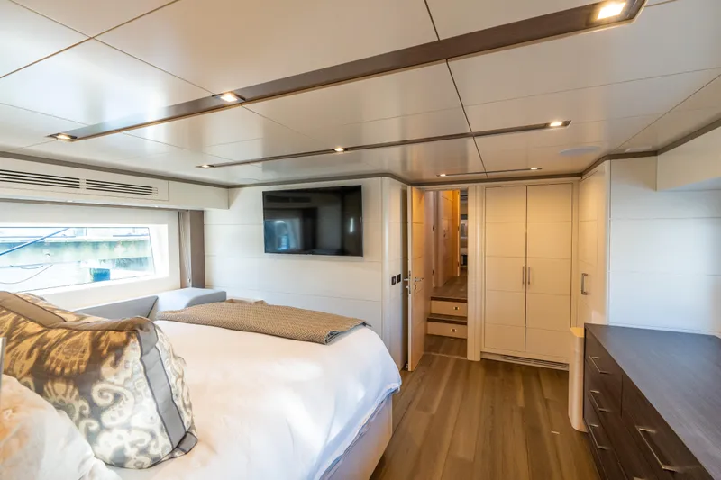 Amor Fati Yacht Photos Pics Luxurious 2019 Sirena 64 yacht bedroom with modern decor and large window.