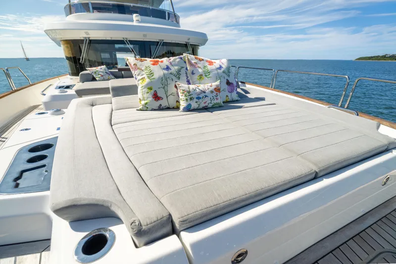 Amor Fati Yacht Photos Pics Luxurious 2019 Sirena 64 yacht with sunbed and colorful cushions on deck.