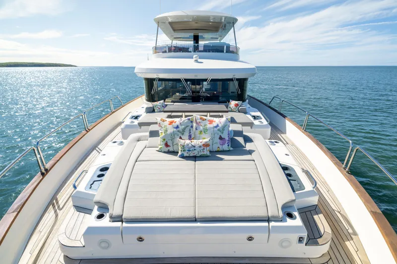 Amor Fati Yacht Photos Pics Luxurious 2019 Sirena 64 yacht deck with sun loungers and ocean view.