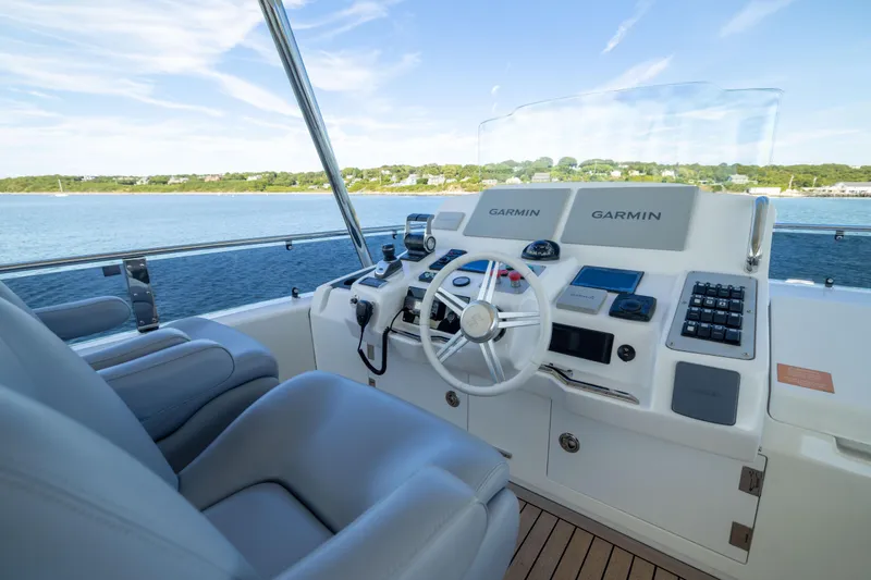 Amor Fati Yacht Photos Pics Luxurious helm of 2019 Sirena 64 yacht with advanced Garmin navigation system.