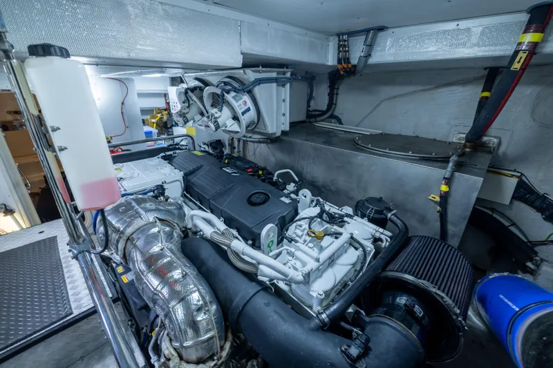 Amor Fati Yacht Photos Pics Engine room of 2019 Sirena 64 yacht, showcasing advanced machinery and components.