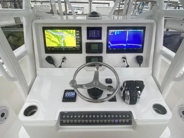  Yacht Photos Pics 2021 Invincible 36 Open Fisherman dashboard with dual navigation screens and controls.