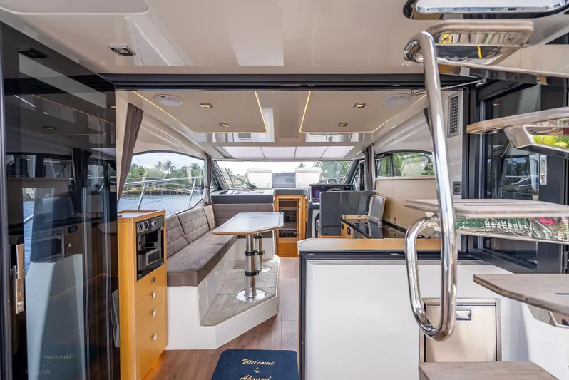  Yacht Photos Pics Luxurious interior of 2021 Skamander Monaco yacht with modern seating and elegant design.