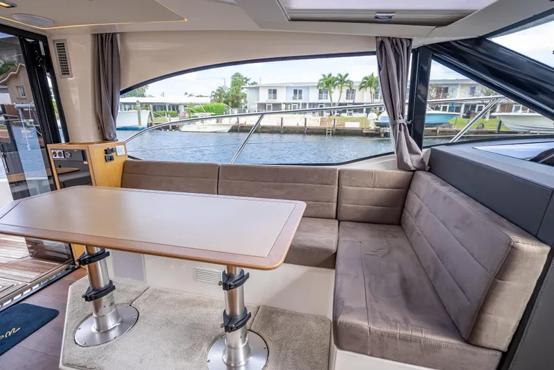  Yacht Photos Pics Luxurious 2021 Skamander Monaco yacht interior with plush seating and waterfront view.