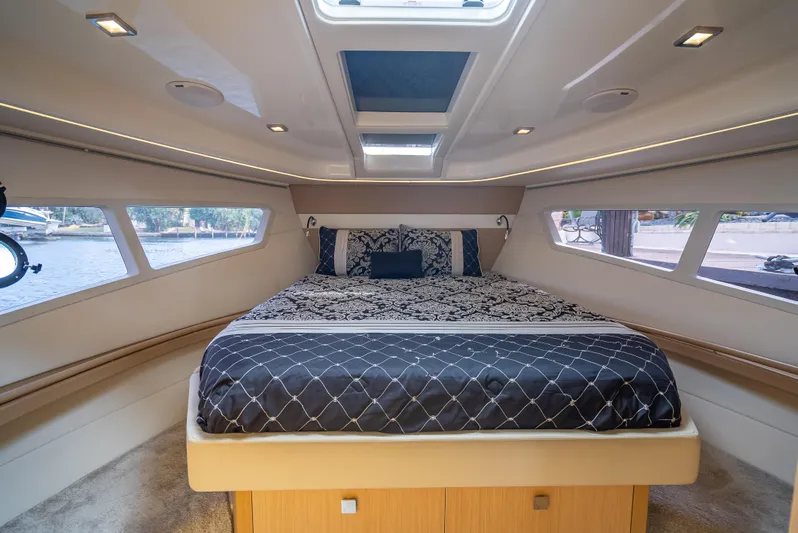  Yacht Photos Pics Luxurious 2021 Skamander Monaco yacht cabin with elegant bedding and panoramic windows.