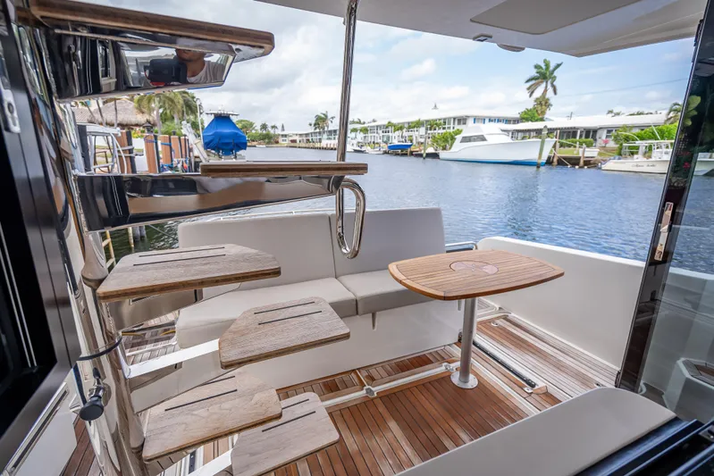  Yacht Photos Pics Luxurious 2021 Skamander Monaco yacht interior with wooden stairs and waterfront view.