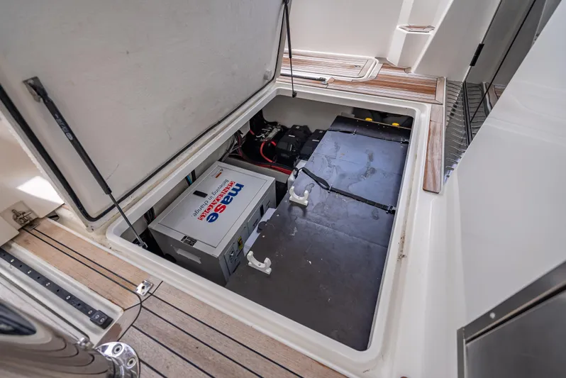  Yacht Photos Pics 2021 Skamander Monaco boat storage compartment with battery and equipment.
