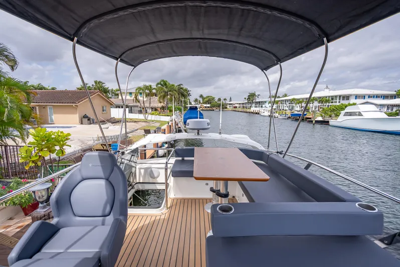  Yacht Photos Pics Luxurious 2021 Skamander Monaco yacht with spacious seating and elegant design on a scenic canal.