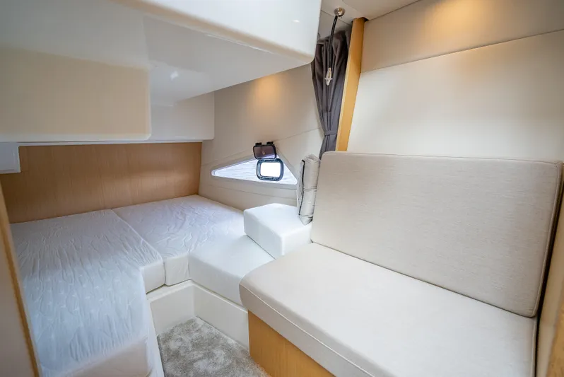  Yacht Photos Pics 2021 Skamander Monaco cabin interior with bed and seating, featuring modern design and soft lighting.