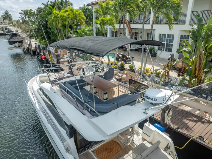  Yacht Photos Pics Luxury 2021 Skamander Monaco yacht docked by a tropical waterfront home.