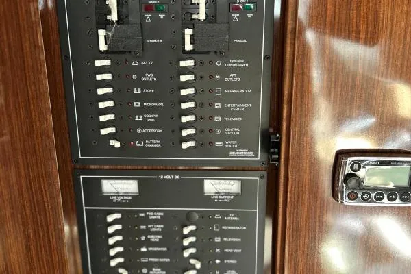 Qtech-1 Yacht Photos Pics Control panel of a 2015 Regal 32 Express boat, featuring various switches and controls.