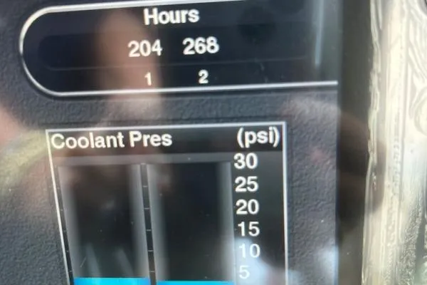 Qtech-1 Yacht Photos Pics Display panel showing engine hours and coolant pressure on a 2015 Regal 32 Express.