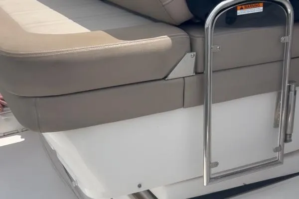 Qtech-1 Yacht Photos Pics 2015 Regal 32 Express boat seating area with stainless steel railing.