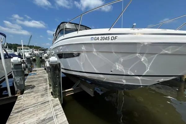 Qtech-1 Yacht Photos Pics 2015 Regal 32 Express boat docked at marina under clear blue sky.