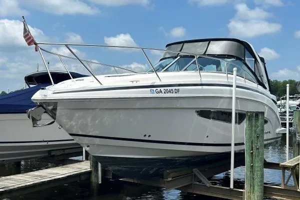 Qtech-1 Yacht Photos Pics 2015 Regal 32 Express boat docked under a clear blue sky.