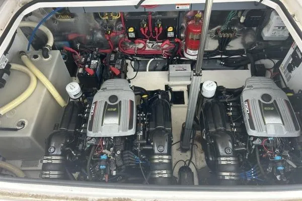 Qtech-1 Yacht Photos Pics Engine compartment of a 2015 Regal 32 Express boat, featuring dual engines and wiring.