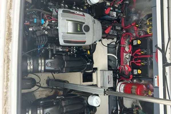 Qtech-1 Yacht Photos Pics Engine room of 2015 Regal 32 Express boat with visible components and wiring.