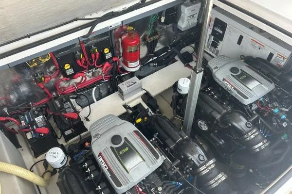 Qtech-1 Yacht Photos Pics Engine compartment of a 2015 Regal 32 Express boat, featuring dual engines and wiring.