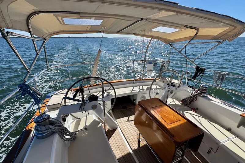 Munequita Yacht Photos Pics Cockpit view of 2013 Tartan 4000 sailboat on sparkling water.