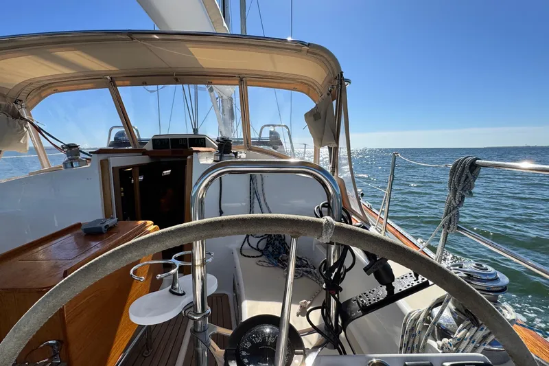 Munequita Yacht Photos Pics Sailing yacht Tartan 4000, 2013 model, steering wheel view on open sea.