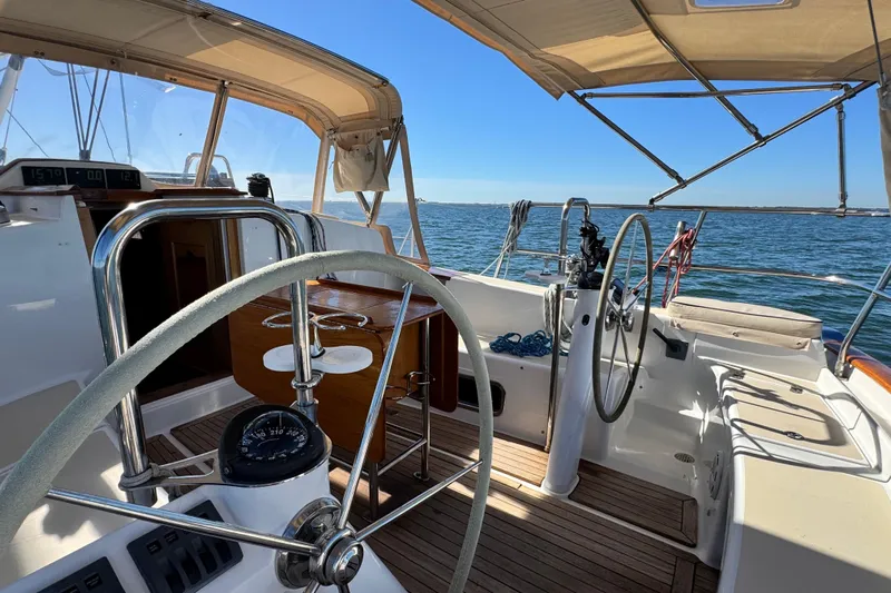 Munequita Yacht Photos Pics Sailing yacht Tartan 4000, 2013 model, with dual steering wheels on open sea.