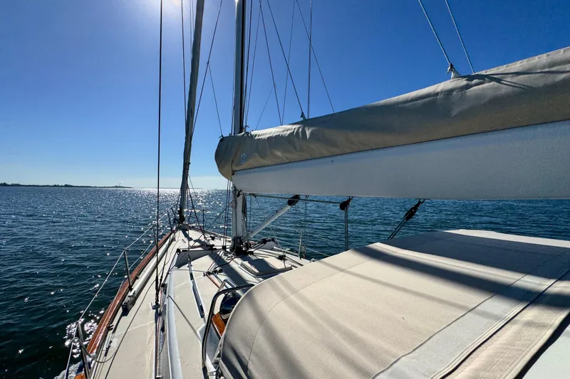 Munequita Yacht Photos Pics Sailing on a 2013 Tartan 4000 yacht under clear blue skies.