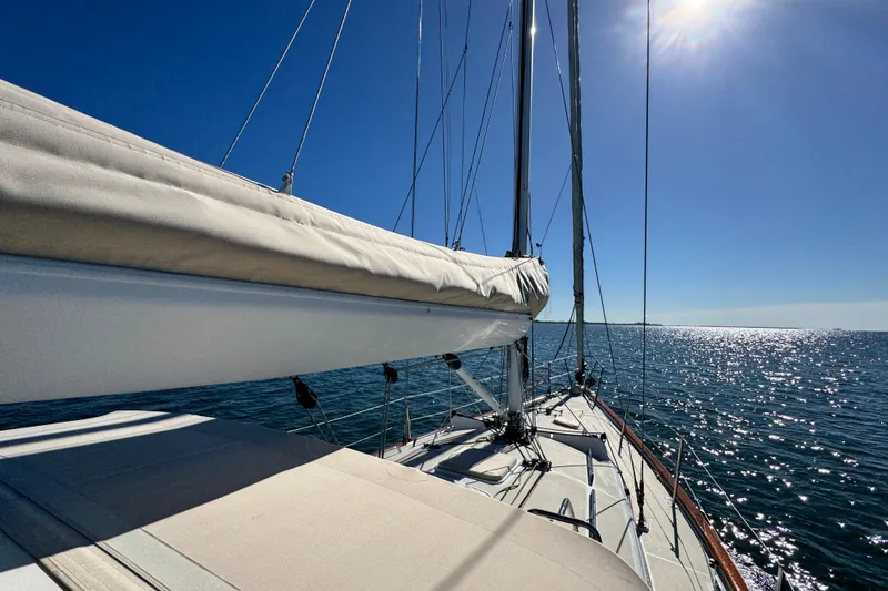 Munequita Yacht Photos Pics Sailing on a 2013 Tartan 4000 yacht under clear blue skies.