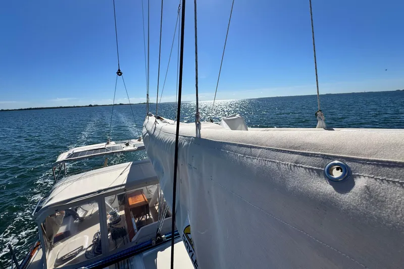 Munequita Yacht Photos Pics Sailing on a 2013 Tartan 4000 yacht under clear blue skies.