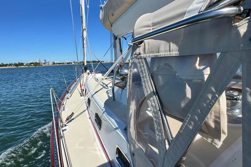 Munequita Yacht Photos Pics Sailing on a 2013 Tartan 4000 yacht, clear blue waters, sunny day.